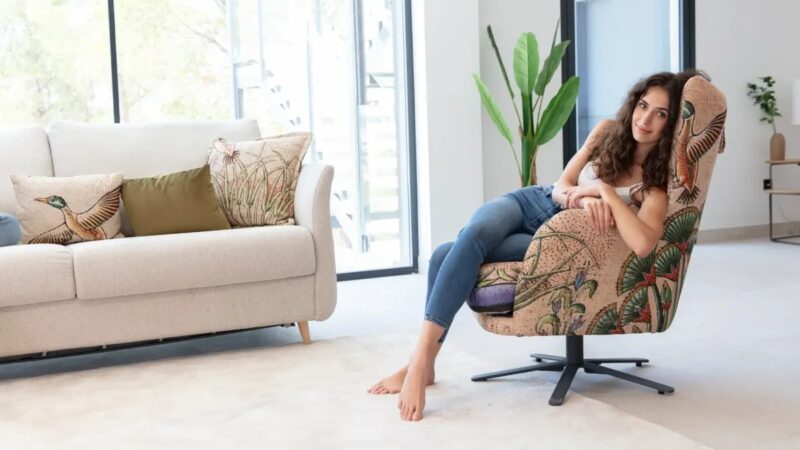 Upholstered armchair and white sofa