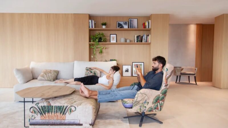 Upholstered armchair and white sofa