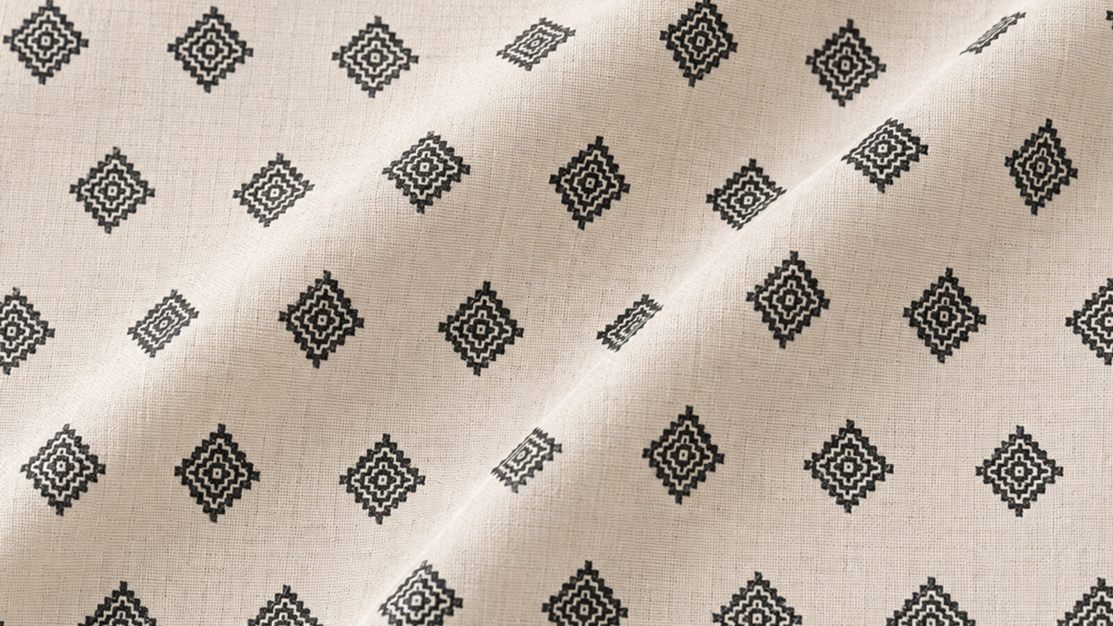 Beige fabric with a repeating black diamond pattern across the surface.